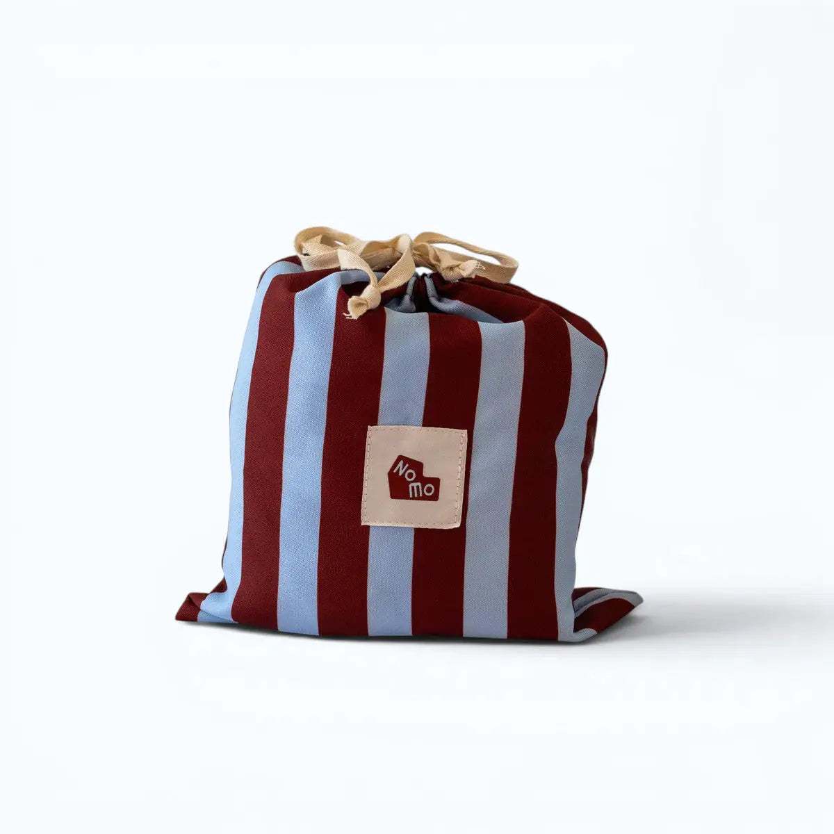 The Ellie Pad reusable drawstring storage bag by NomoHaus with striped design and “No Mo” logo patch on white background