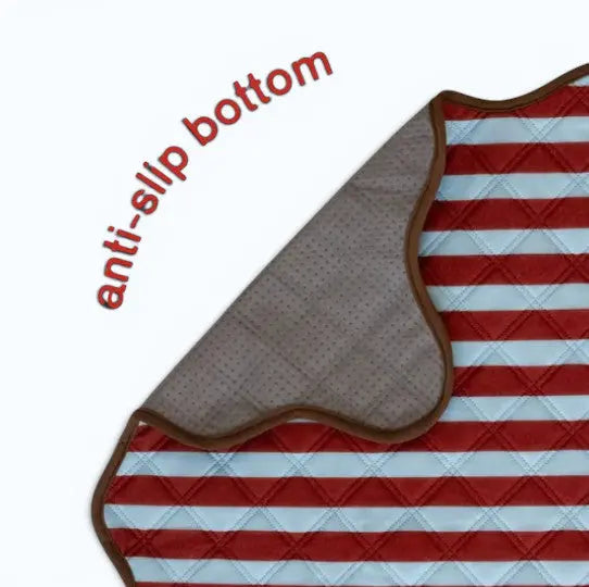 The Ellie Pad reusable washable dog pee pad by NomoHaus with anti-slip waterproof base and red striped pattern