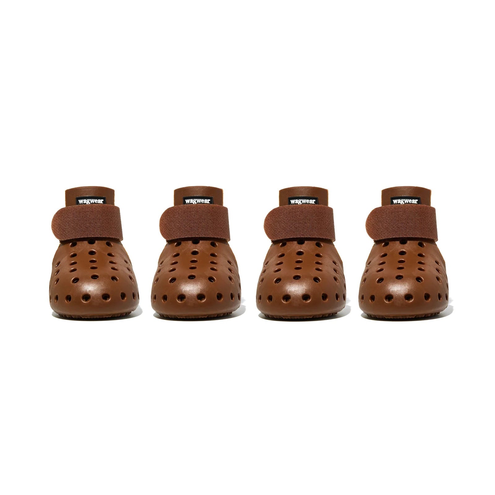 Four pairs of brown dog boots with Velcro straps on a white background - Fluffy Collective