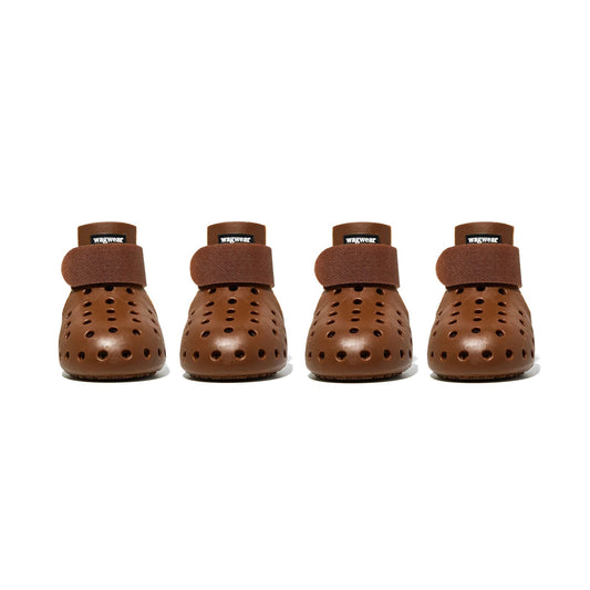 Four pairs of brown dog boots with Velcro straps on a white background - Fluffy Collective